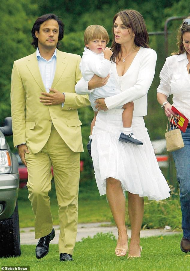 Arun is not Damian's biological father, but Elizabeth has previously said she always considered him his father after the former couple married when Damian was five (pictured in 2006)