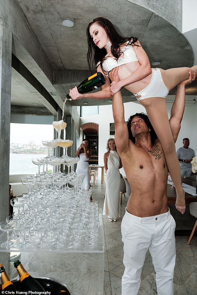 A highlight of the evening was an acrobatic performance that ended with the dancers pouring bottles of bubbly into a six-story champagne tower