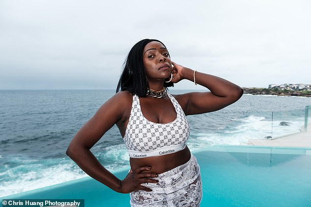 Suzan Mutesi poses by the pool