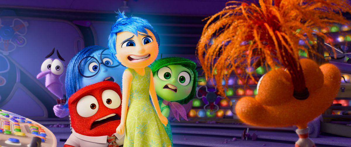 Joy, Sadness, Anger, Disgust and Fear look uneasily at a new emotion, Fear, in Inside Out 2 from Pixar Animation Studios