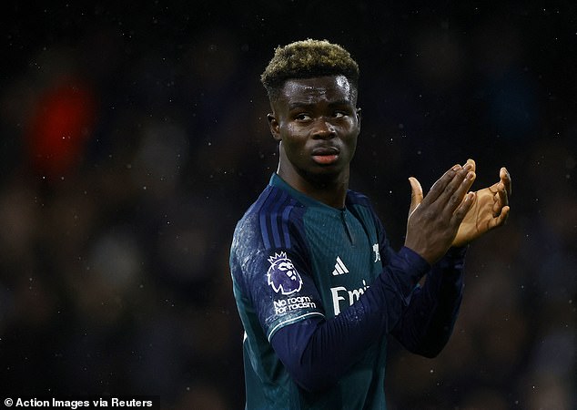 A disappointed Bukayo Saka cheers on the Gunners fans after their latest setback