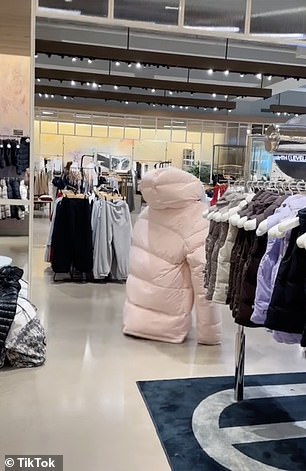 The 29-year-old New Jersey-born creator toddled around the store in the floor-length coat