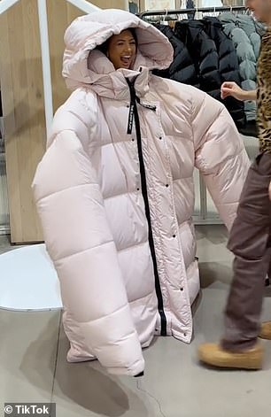 Ashley's feet were barely visible in the truly enormous jacket, which is on display at the trendy retailer