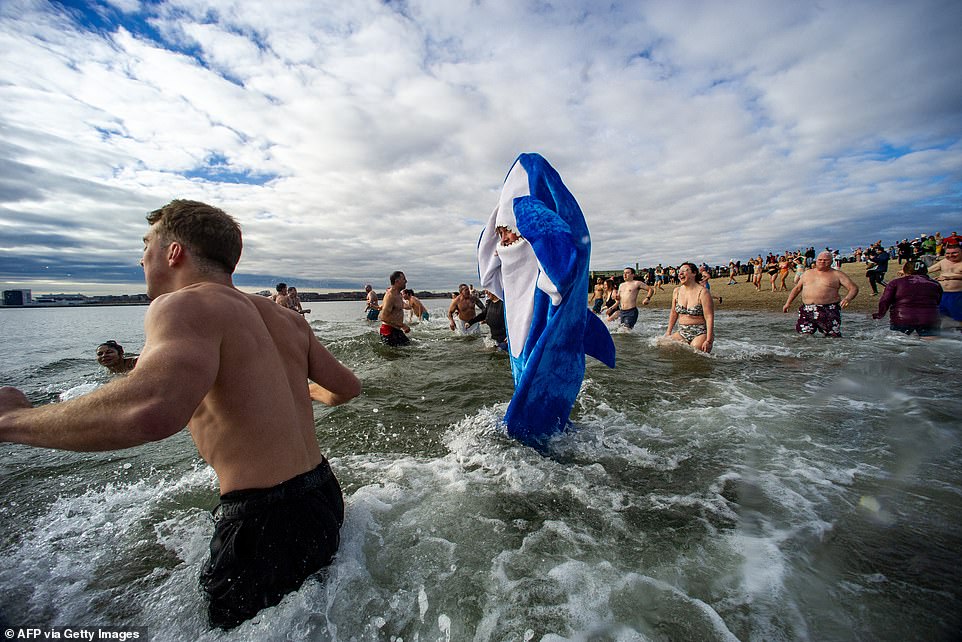 MORE swimmers enjoy the fresh water during the cold water dive at the L-Street Brownies