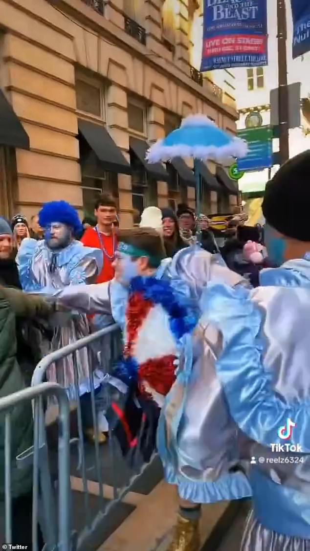 The mummer is seen sneaking towards the spectator during the exchange