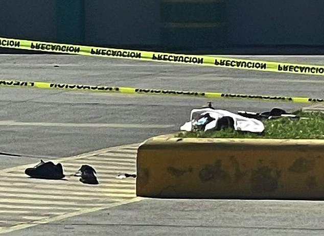 The shoes of a 19-year-old man arrested Saturday in Quiroga, Mexico, lie on the ground at a gas station where his sister's head was found next to her body