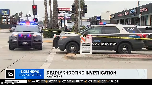 Police cruisers are seen at the scene of the Hawthorne shooting Monday morning