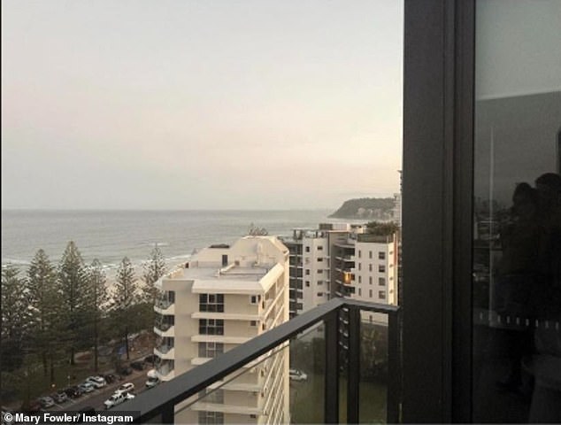 If you take a closer look at this photo taken from the balcony of a Gold Coast high-rise, it appears that Cleary is hugging Fowler in the reflection in the window (far right)