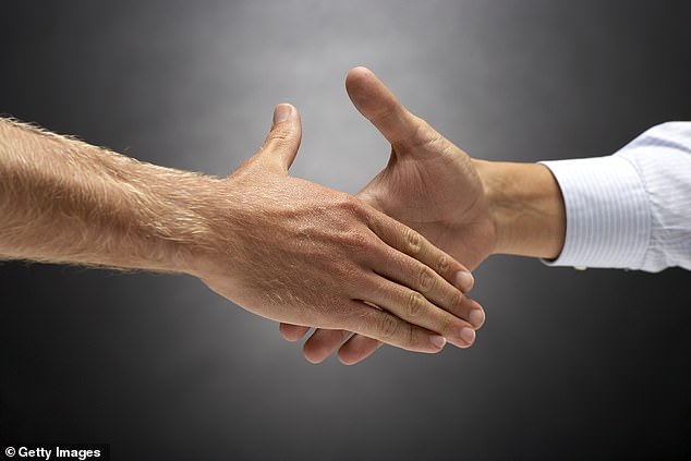 Ask a friend to rate whether your handshake is crushing, average, or weak (file image)