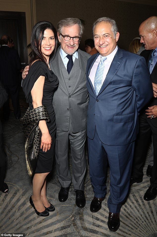 Shira Lipsey (left), Steven Spielberg (center) and Joseph Lipsey (right) pictured at a gala in 2018. Pierce befriends Lipsey's son and the two are executive producers of a new Christmas movie