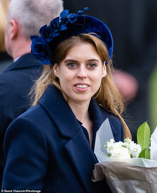 Princess Beatrice of York looks chic in a padded navy blue headband at Sandringham