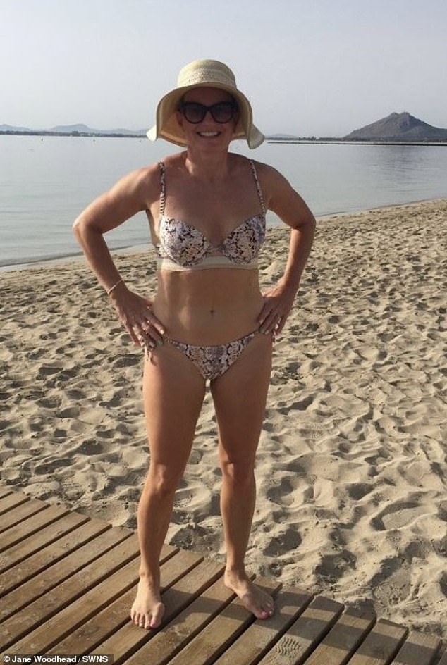 Jane lost more than a stone and added muscle all over her body by overhauling her diet and fitness regime for 12 weeks (pictured whilst on holiday in July 2022)