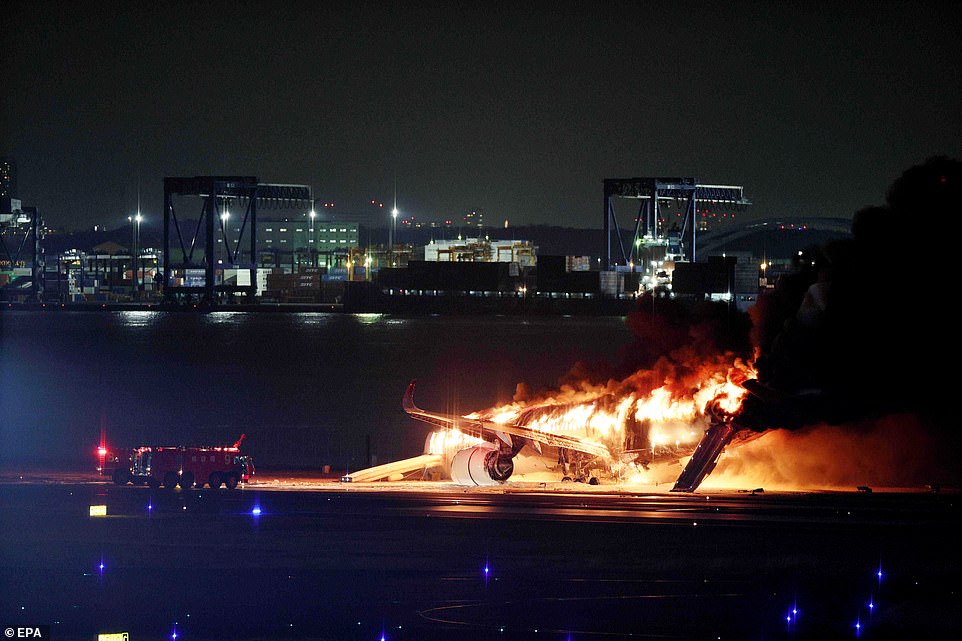 A Japan Airline (JAL) passenger plane bursts into flames on the tarmac of Haneda Airport