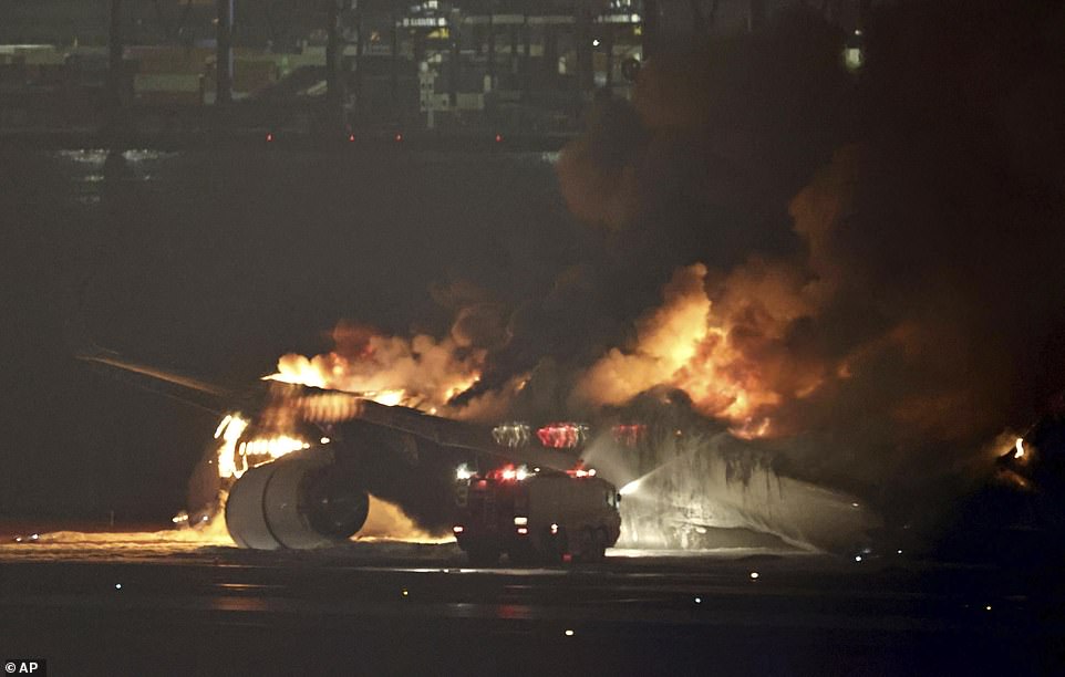 A Japan Airlines plane catches fire on the runway of Tokyo's Haneda Airport on Tuesday, Jan. 2, 2024. (Kyodo News via AP)