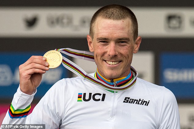 Dennis celebrates on the podium after winning the Elite Men's individual time trial at the 2019 UCI Road World Championships in Harrogate, Northern England