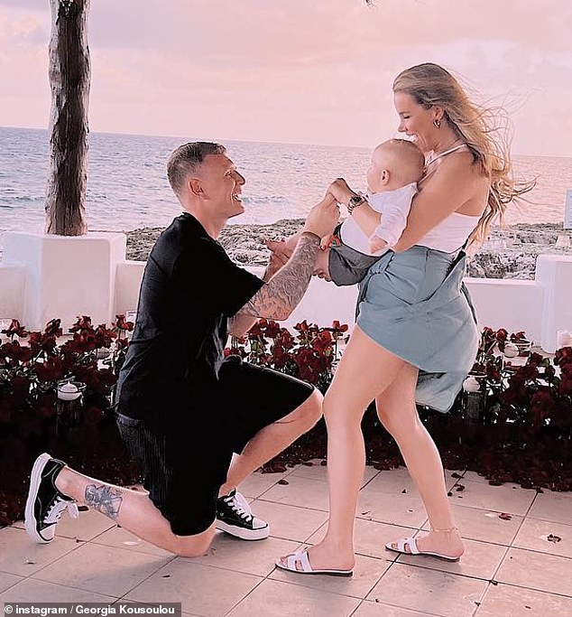 Tommy proposed to Georgia after eight years together on a beach pergola surrounded by roses after they flew to Mexico for a family getaway in February 2022