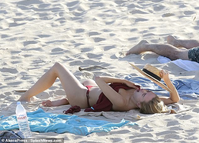 Kimberley was caught mid-yawn as she enjoyed a day off from her swimwear shoot