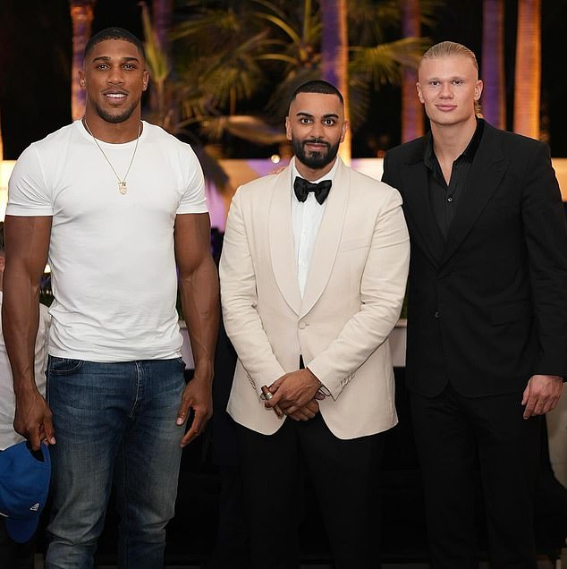 Manchester City footballer Haaland, 23, (right) looked smart in a black suit as he posed with Umar, 35, (middle) and Anthony (left)