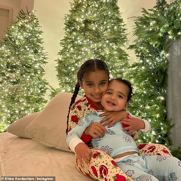 Khloe shared a photo of her children in front of their Christmas trees