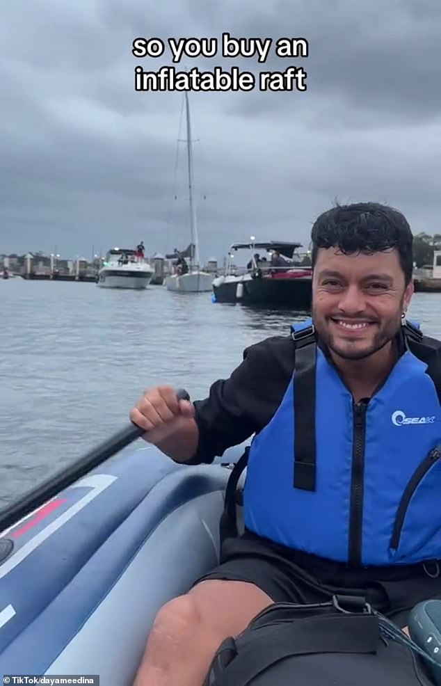 The couple bought a raft, life jackets and a lamp for $160 and paddled out to watch the midnight fireworks from the comfort of their inflatable boat (pictured)