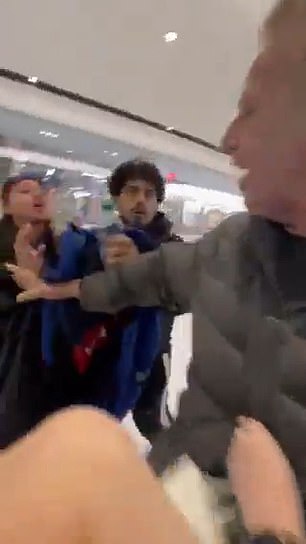 “Free Palestine, f***ing that b***h,” a young woman is heard shouting at the family in the video, as the Jewish father (right) extends his arm to separate the aggressors from his wife and children