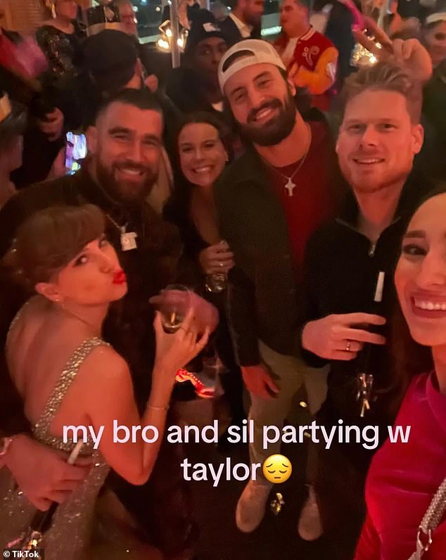 A further photo from the festivities showed Taylor pouting as she posed with Travis and a group of friends