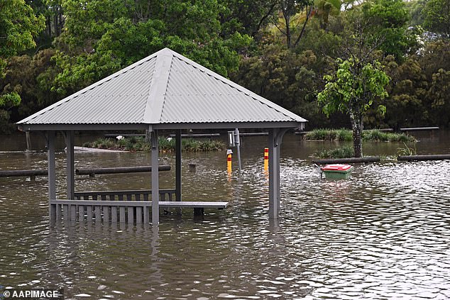 The park in Mudgeeraba is flooded after flash flooding caused by rainfall on the Gold Coast on Monday evening