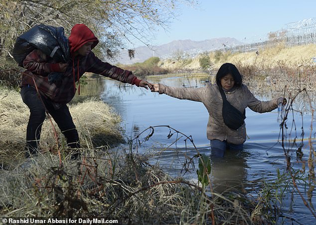 Migrants cross the Rio Grande from Juarez, Mexico, to the US