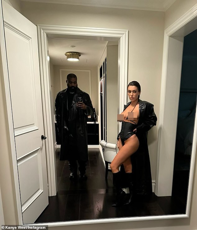 On Tuesday, the 46-year-old hitmaker also shared a mirror selfie of himself standing in a doorway covered from head to toe.  In the same move, Censori stood to the side, modeling a barely-there thong bikini, a black corset, and a leather trench coat.