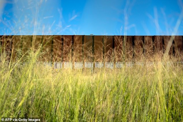 The sudden attack took place in the Mexican state of Sonora, in an area heavily contested by rival smuggling gangs (photo: US-Mexico border wall in Agua Prieta, Sonora)