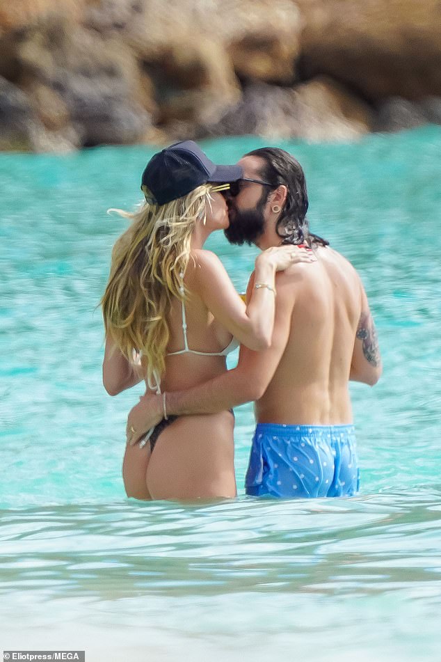 The couple also kissed while Heidi wore a bikini top with her bottoms and added a hat