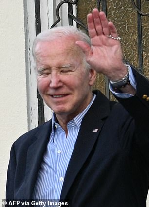 U.S. President Joe Biden waves as he leaves Holy Cross Catholic Church in Christiansted on St. Croix, U.S. Virgin Islands on December 30