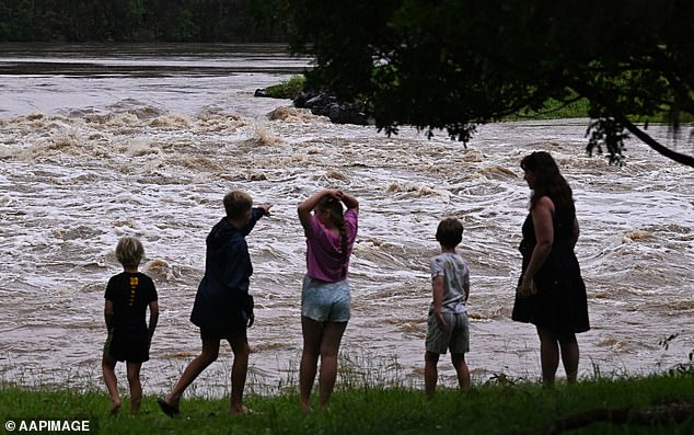 Flood-weary residents in southeast Queensland will brace for another round of heavy rain and thunderstorms on Wednesday (Photo: Gold Coast's swollen Coomera River)