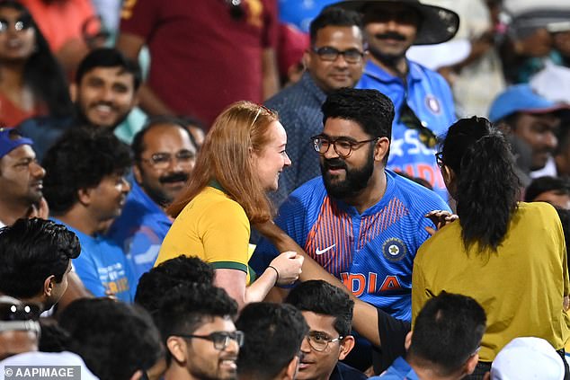 In 2020 at the SCG during an ODI match, a fan wearing an Indian jersey got down on one knee and asked his girlfriend - wearing an Australian shirt (left) - to be his wife