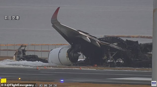 Photos from the scene show the charred wreckage of the Japan Airlines flight the morning after the collision