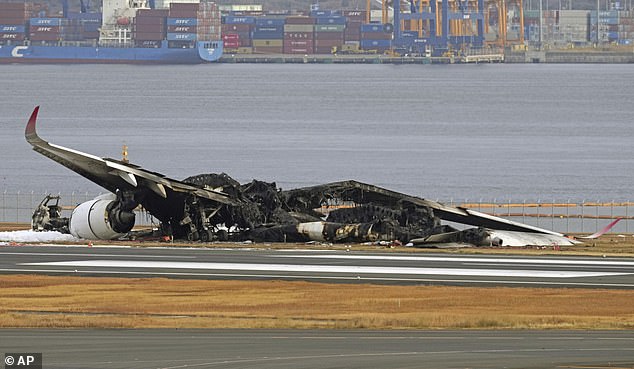 The burned-out Japan Airlines plane is seen at Haneda Airport on Wednesday, January 3, 2024