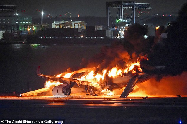 Japan Airlines plane flight 516 burns at Haneda Airport on January 2, 2024 in Tokyo, Japan