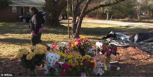 The community built a memorial of stuffed animals and flowers outside Hernandez's home