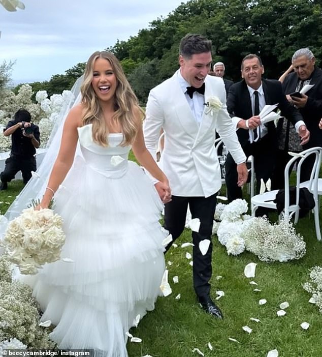 Bri Gardoni was stunning in a white wedding dress, while Moses looked sharp in a tuxedo jacket