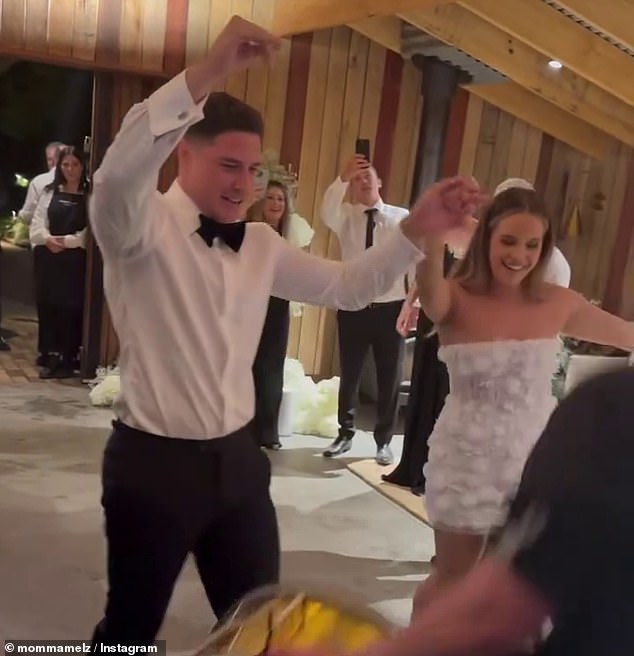 Moses and Gardoni (pictured dancing into the reception after exchanging vows) have been dating since 2018 and have a daughter together