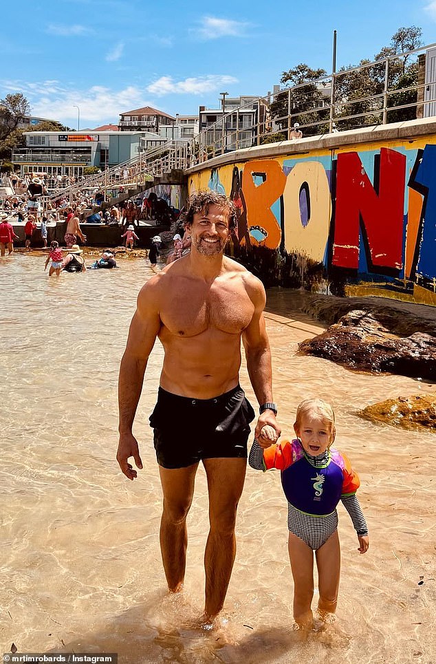 The muscular Bachelor star enjoyed surfing and sunning at the famous tourist destination with his wife Anna Heinrich and their three-year-old daughter Elle