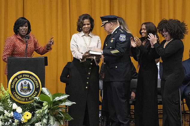 Parker is seen swearing in the new Philadelphia Police Commissioner, Kevin Bethel, on Tuesday