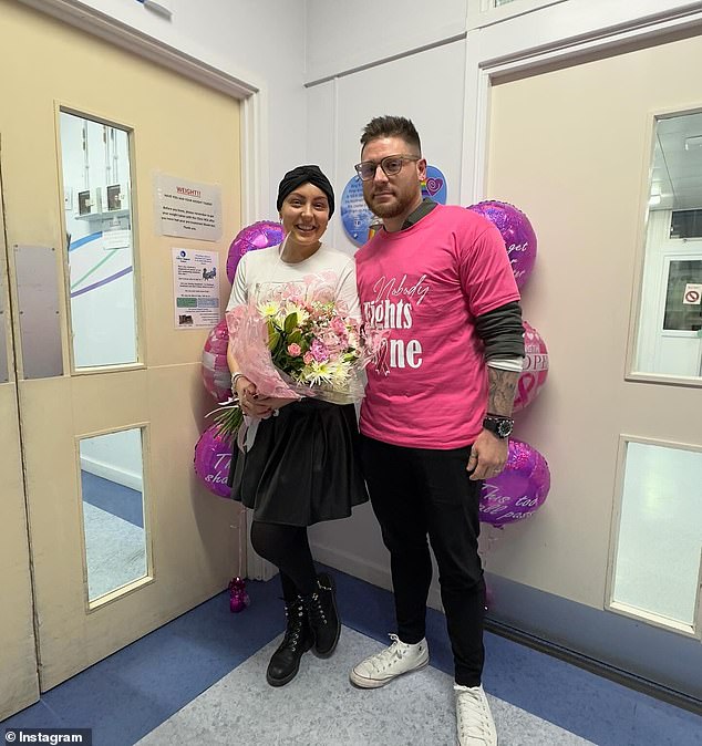Amy celebrated her final round of chemotherapy in November and rang the traditional end-of-treatment bell to celebrate (seen with husband Ben)