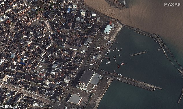 An aerial view of capsized boats and damaged buildings in Suzu, Ishikawa Prefecture, Japan, is seen on January 2, 2024 - the day after the New Year's Day earthquake