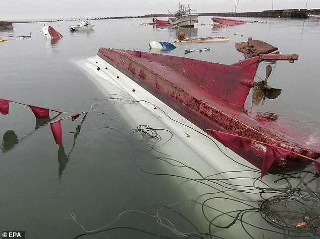 Fishing boats capsized after a strong earthquake at a fishing port in Suzu, Ishikawa Prefecture, central Japan, on January 3