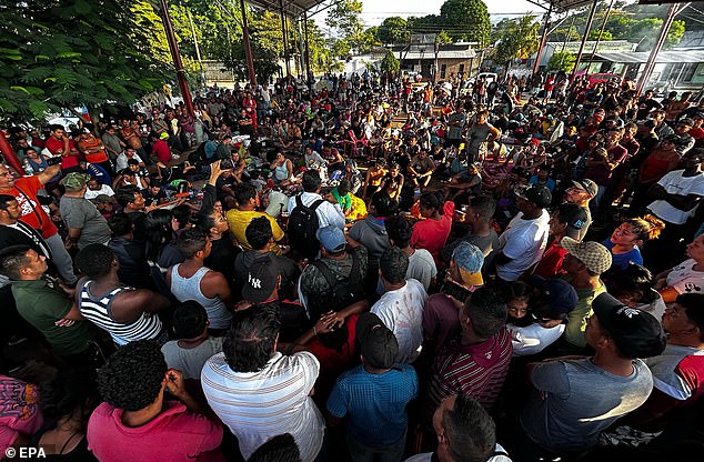 Officials from the Chiapas Center for Human Dignification (CDH) speak with migrants who left a caravan bound for the United States, in the city of Mapastepec, Chiapas state, Mexico, December 30, 2023