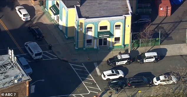 A few hours after the shooting, police stood outside the entrance to the mosque