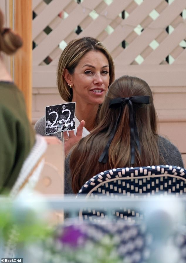 While at the restaurant, Christine appeared to be dining with her 13-year-old daughter Grace Avery Costner