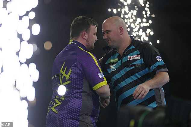 Rob Cross congratulates Littler on his victory after the thrilling 6-2 match, which saw the 16-year-old prodigy claim victory with two far straight sets