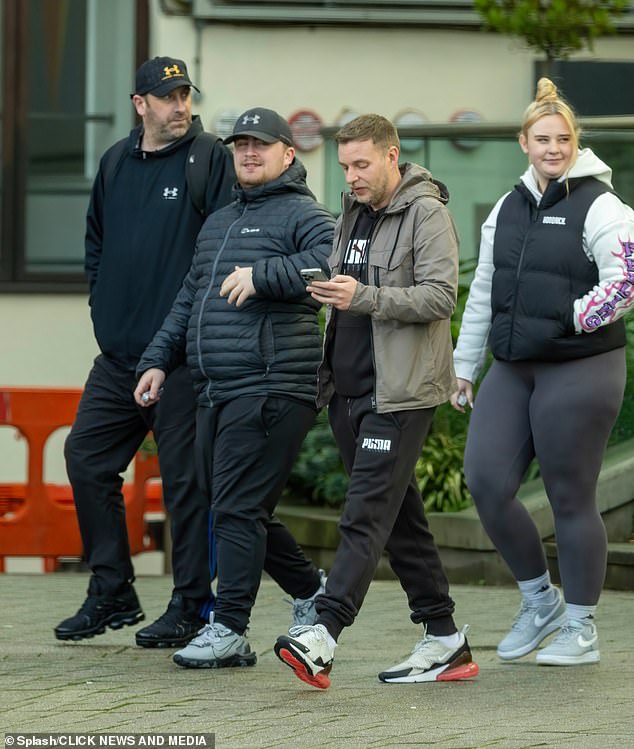 Littler steps out with his dad (left), his manager (middle) and his girlfriend (right) ahead of the big night